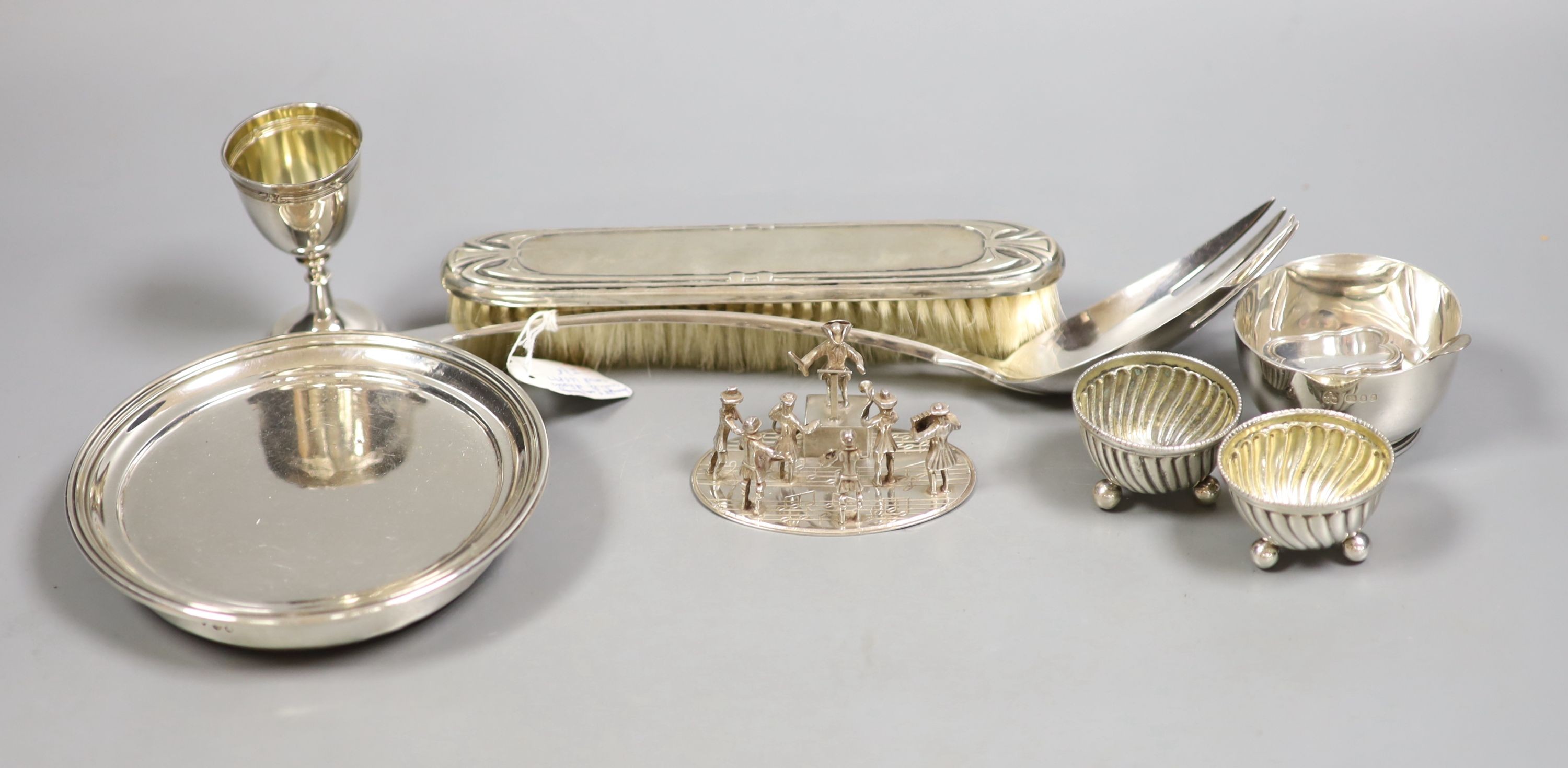 A small group of silver and white metal items including a William IV mounted coaster, London, 1830, 12.9cm, a small silver bowl and pill, box, a Georgian caddy spoon, two Austro-Hungarian salts, and 800 egg cup, a Dutch